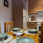 Acogedor En *