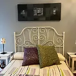 Acogedor En *